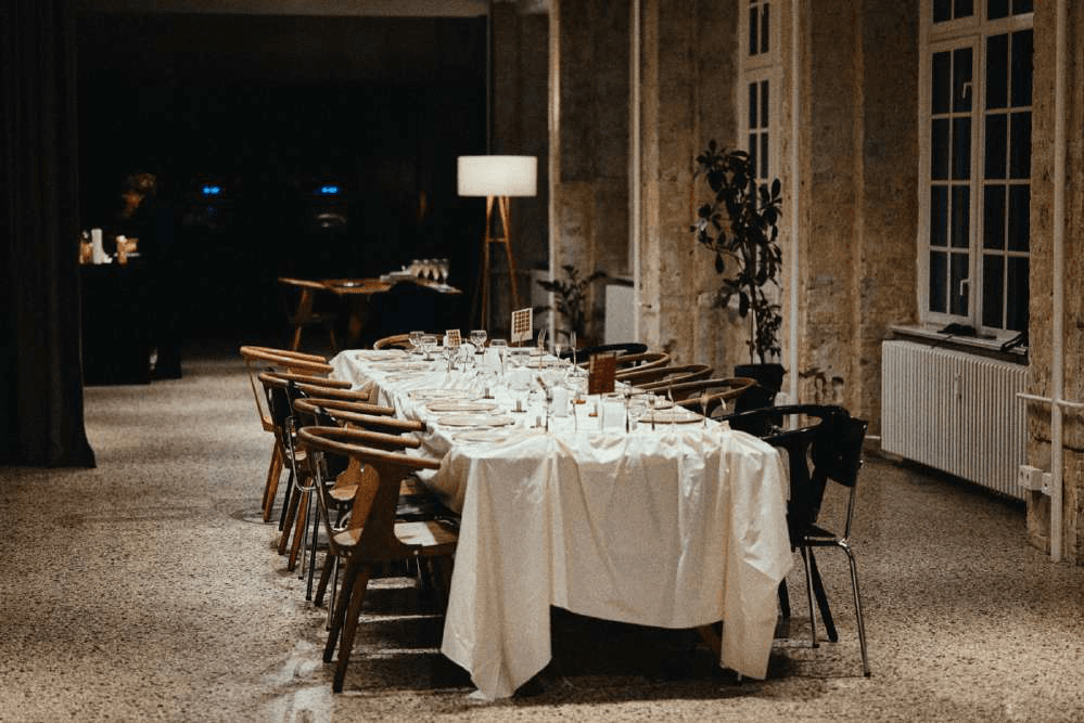 Long dinner table set in the Friends Space